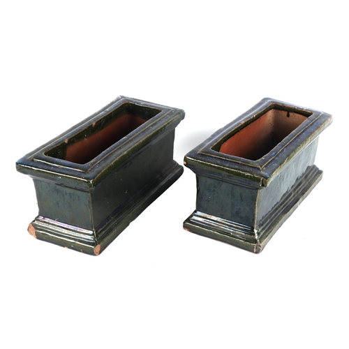 2 - A pair of green glazed terracotta planters, each 34cm wide, (2)