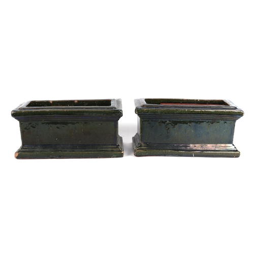 2 - A pair of green glazed terracotta planters, each 34cm wide, (2)