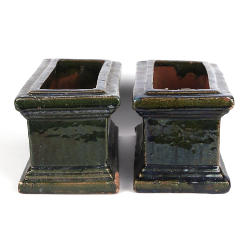 2 - A pair of green glazed terracotta planters, each 34cm wide, (2)