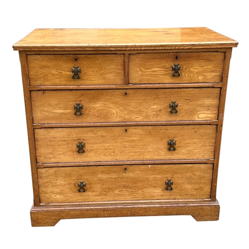 2003 - A late 19th century ash chest with two short and three graduated long drawers with Gothic brass hand... 