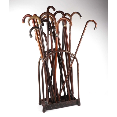 2005 - An unusual country house domed brass and iron stick stand of eight divisions, with a selection of ho... 