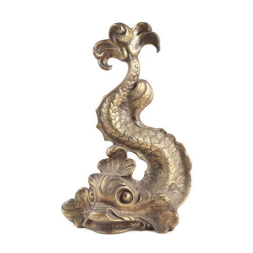 2009 - A Regency style cast brass doorstop in the form of a stylised dolphin, 35cms high.