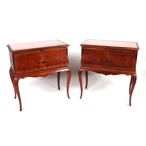 2014 - A pair of French bedside cabinets, possibly fruitwood, the rectangular top above a brushing slide wi... 