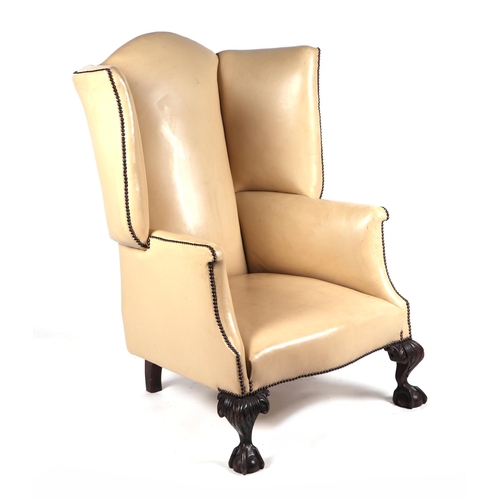 2078 - A George II style cream leather upholstered wingback armchair on carved cabriole front supports term... 