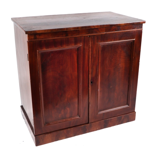 2080 - A Victorian mahogany cabinet, the pair of fielded panelled doors enclosing a fitted interior of two ... 