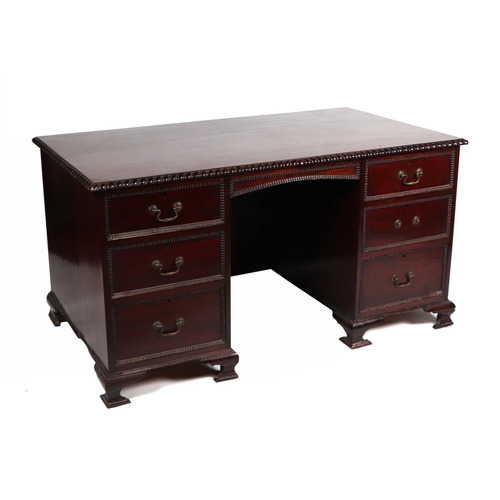 2083 - A George III style mahogany kneehole pedestal desk, the rectangular top with carved rope twist edge,... 