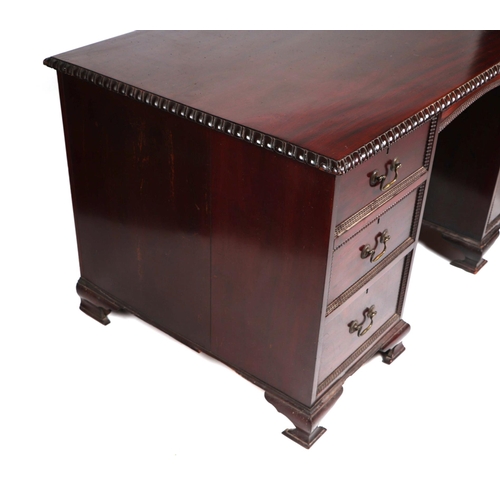 2083 - A George III style mahogany kneehole pedestal desk, the rectangular top with carved rope twist edge,... 