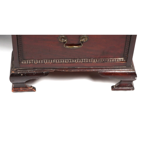 2083 - A George III style mahogany kneehole pedestal desk, the rectangular top with carved rope twist edge,... 