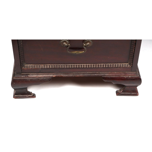 2083 - A George III style mahogany kneehole pedestal desk, the rectangular top with carved rope twist edge,... 