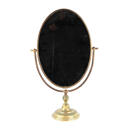 2085 - A Regency style brass swing mirror with oval plate, 35cms wide.