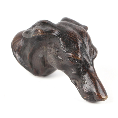 227 - A bronze study of a dogs head, 10cms long.