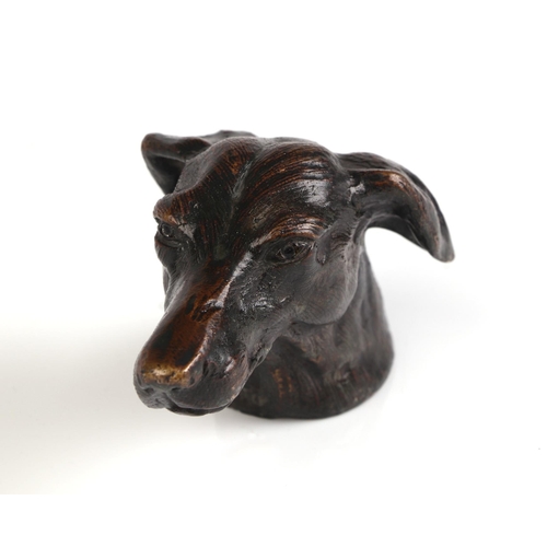 227 - A bronze study of a dogs head, 10cms long.