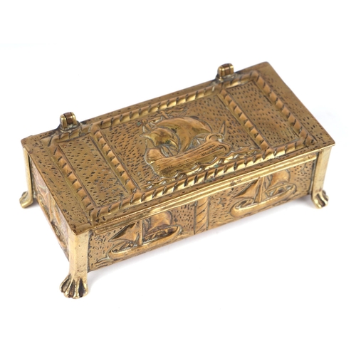 228 - A Newlyn style brass table top box decorated with ships, 19cms wide.