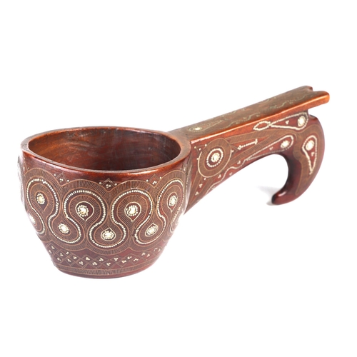 229 - A Russian carved hardwood kovsh with white metal inlay decoration, 19cms long.