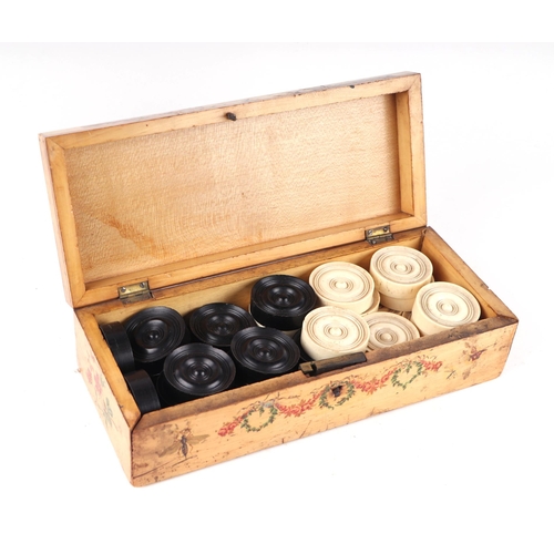 240 - A set of 19th century turned ebony and bone draughts or backgammon counters in a box with painted bi... 