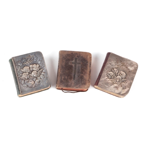 244 - Three miniature Common Prayer books, two with silver covers, after Reynolds (3).