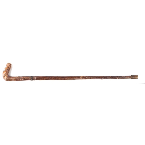 255 - A treen walking stick, the handle carved in the form of a mermaid, 82cms long; together with a surve... 