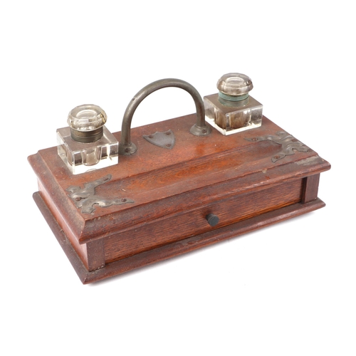 260 - A George V oak desk stand with two glass inkwells, pen tray and a single drawer, 31cm wide; together... 