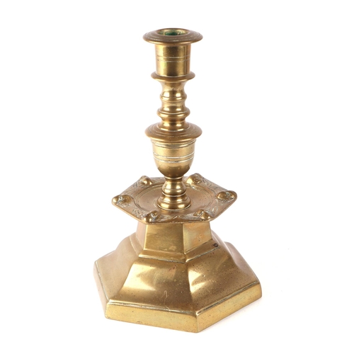 266 - A Flemish 17th century style brass candlestick, 22cms high.