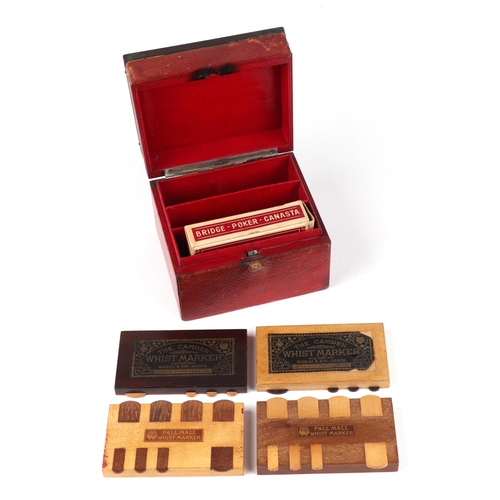 276 - A vintage tooled red leather box containing hardwood whist markers, 12cm wide.