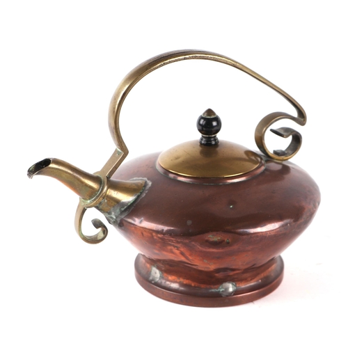 279 - An Arts & Crafts Benham & Froud brass and copper kettle, RD No. 92406, 19cms high.