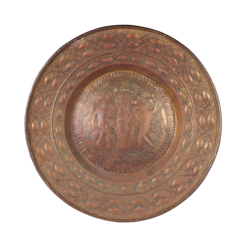 283 - An Arts & Crafts copper charger with embossed decoration depicting Adam and Eve, 56cms diameter.