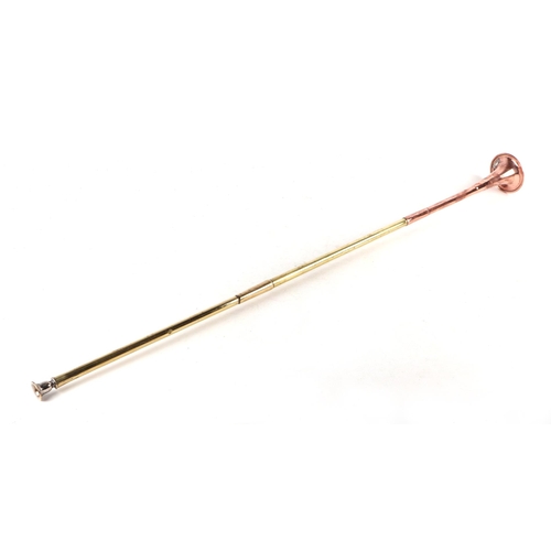 284 - A copper & brass coaching horn, 100cms long.