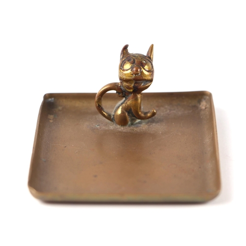 286 - A 1950's cast brass ashtray surmounted a stylised cat, the base impressed 'WHM Made in Austria', 5.5... 