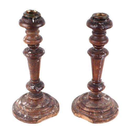 290 - A pair of Victorian turned oak candlesticks with brass sconces, each 26cms high (2).