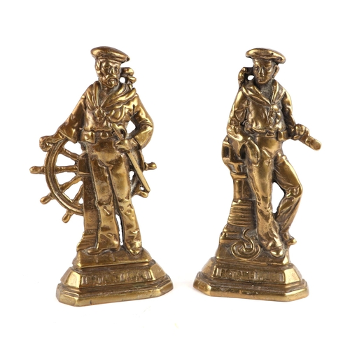 291 - A pair of Victorian cast brass door stops in the form of sailors, both titled 'Britain's Pride', eac... 