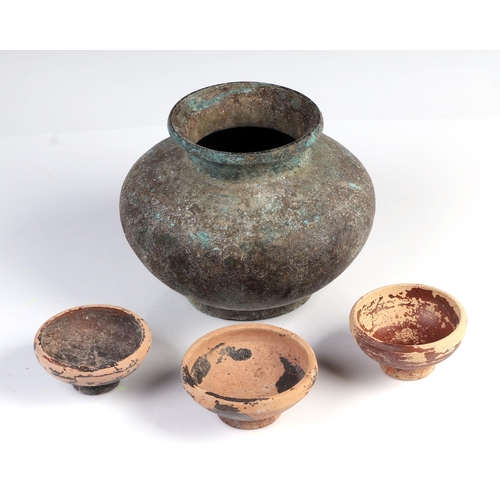 295 - Antiquities. A group of Greek / Roman small pottery bowls, largest 9cm diameter together with a bron... 