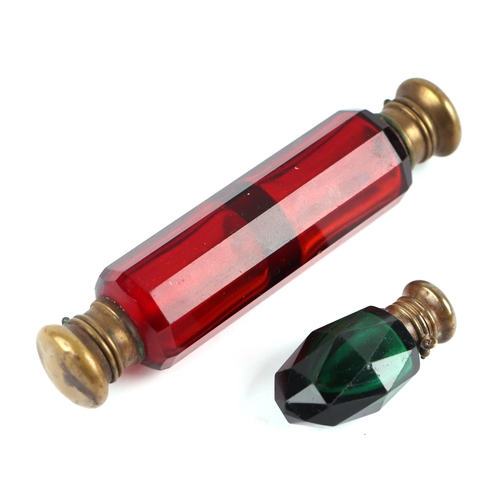 30 - A Victorian cranberry glass double ended scent bottle; together with a faceted green glass scent bot... 