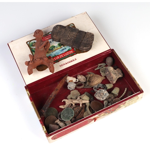 308 - A group of metal detecting finds, together with a carved stone figure with script to the reverse and... 