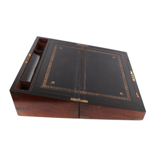 317 - A late 19th/ early 20th Century brass bound figured walnut writing slope, with brass presentation pl... 