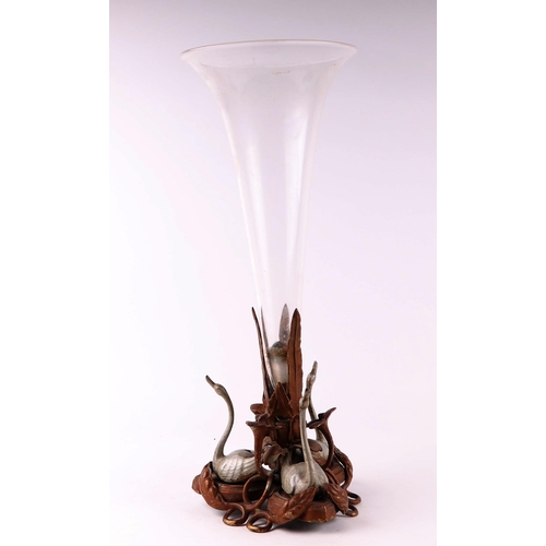 34 - A large Victorian glass centerpiece with central trumpet shaped vase on a painted and cast brass bas... 