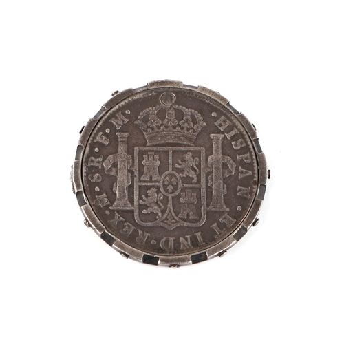 354 - A George III Mexican 1777 8 reals with countermark, in a silver mount.