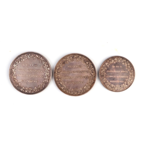 374 - Three Stonyhurst college silver prize medallions, all cased (3).