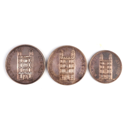 374 - Three Stonyhurst college silver prize medallions, all cased (3).