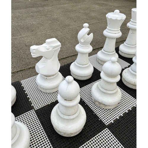 4 - A contemporary plastic oversized garden or public park chess set, king 64cms high.