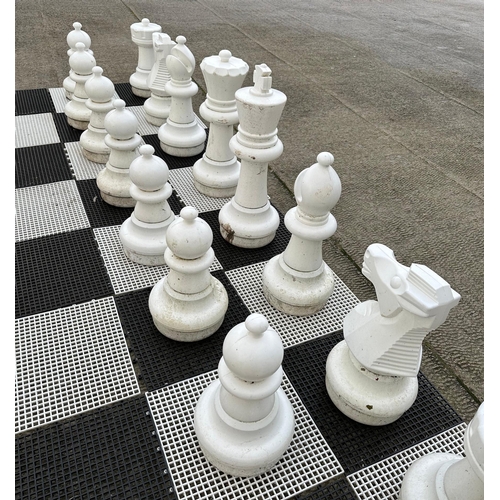 4 - A contemporary plastic oversized garden or public park chess set, king 64cms high.