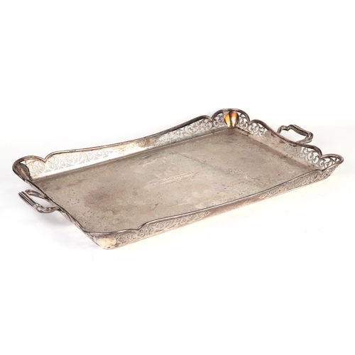 425 - A silver two-handled tray with pierced gallery and engraved with foliate scrolls, having a presentat... 