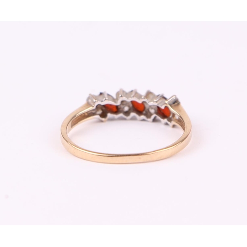 498 - A 9ct gold dress ring set with red and white stones, approx UK size 'S', 1.8g