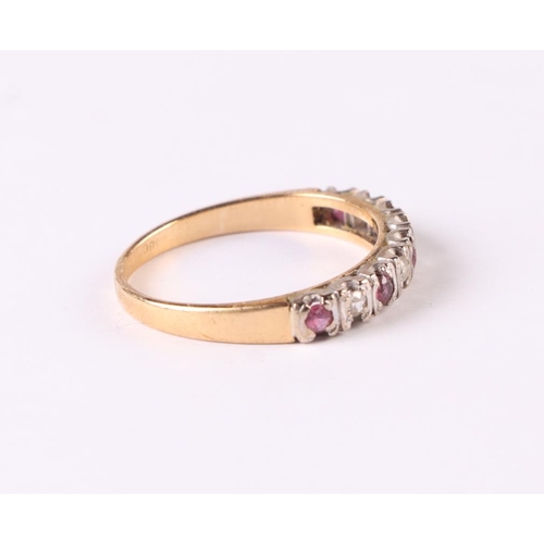 510 - An 18ct gold ruby and diamond half eternity ring, approx UK size 'O', 2.6g.