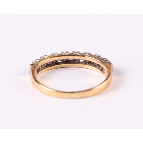 510 - An 18ct gold ruby and diamond half eternity ring, approx UK size 'O', 2.6g.