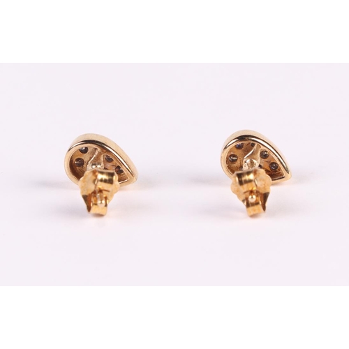 534 - A pair of 9ct gold tear drop shaped diamond set stud earrings, 1.6g.