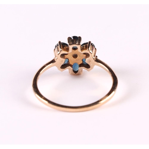 535 - A 9ct gold daisy cluster ring set with a central diamond surrounded by sapphires, approx UK size 'O'... 