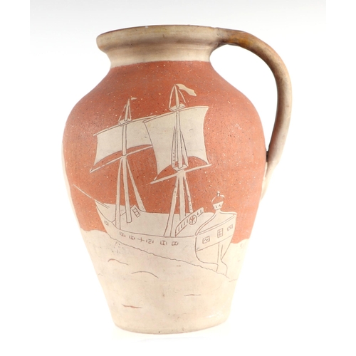 54 - A West Country Art pottery slipware jug decorated with a sailing ship and an Egyptian Faluka boat, i... 