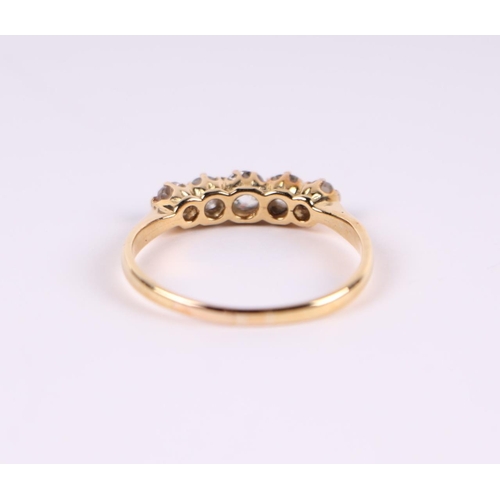 562 - An 18ct gold five-stone diamond ring, approx UK size 'P', 2.5g.