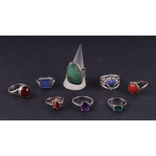 569 - Seven gem set silver rings, to include lapis lazuli and amethyst together with a 9ct gold and silver... 