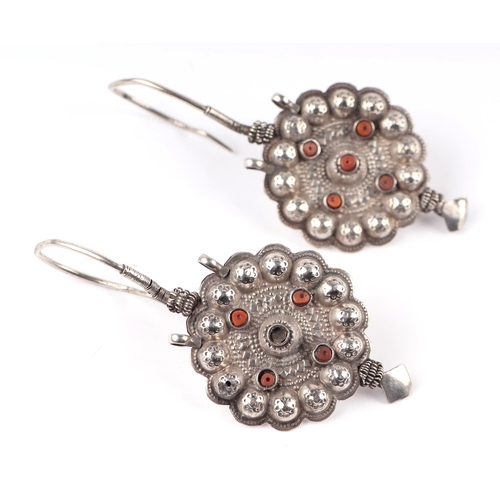 570 - A large pair of Tibetan white metal (tests as silver) hook earrings set with coral beads, 9cm high, ... 